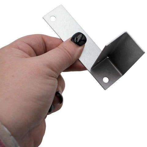 Person holding metal bracket from Ice Machine Water Valve Replacement Kit IH9121 000009121 With Brackets And Screws, 220/240V