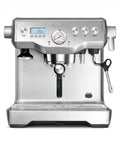 Dual Boiler Espresso Machine in Brushed Stainless Steel Featuring 58mm Commercial Portafilter and Precision Temp Control for Killer Shots and Legit Barista Quality Coffee at Home, front view with LCD panel and steam wand.