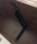 Heavy Duty Black Metal Shelf Brackets Rock Solid Wall Mount Support on wooden shelf with rust proof design.
