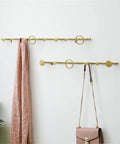 Premium Wrought Iron Coat Hook With Smooth Rounded Edges That Saves Serious Square Footage And Brings Chill Rustic Vibes To Any Front Door Or Mudroom Wall, showcasing a stylish gold hanger.