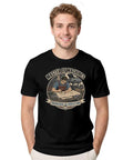 Rad Vintage Engineer T-Shirt With Blueprint Garage Design For Real Mechanics And Fabrication Geeks Who Love Drawing Sketches And Building Cool Stuff In The Shop Or At Home. Black cotton tee with a graphic design worn by a smiling man.