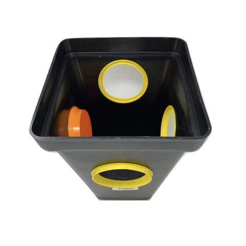 Top view of 4 Hole Distribution Box For 4 Inch Pipe With Fittings, Tough HDPE Injection Molded Enclosure with yellow seals and orange plugs.
