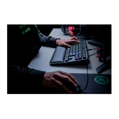 Classic Black Tenkeyless Mechanical Gaming Keyboard With Tactile Orange Switches And Smooth RGB Backlighting in use with a mouse.