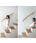 Child using Built Like A Tank Adjustable Solid Wood Handrail Kit Tough Metal Brackets Nonslip Stair Railing on stairs.