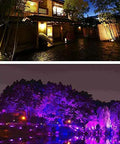JUDYSSY Led Flood Lights Outdoor Solar Lights illuminating a garden and pathway at night with colorful lights.