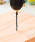 Heavy Duty No Sweat Number 6 By 1 Inch Drywall And Wood Screws featuring coarse threading installed in wood.