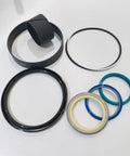 Heavy Duty Hydraulic Cylinder Seal Kit Compatible With Caterpillar 3133829 For Excavator Construction Machinery Repair Aftermarket Replacement Parts To Fix Hydraulic Leaks And Get Your Rig Running Smooth With Quality Seals For Durable Performance., black and blue hydraulic cylinder seal rings on white background