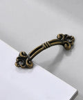 Vintage Bronze Mini Drawer Pulls Set Of 20, 1.85 Inch Antique Jewelry Box Handles, solid zinc alloy hardware mounted on white surface