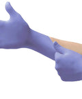 Person wearing violet Disposable Nitrile Gloves Latex Free Powder Free For Cleaning Mechanics Automotive Industrial And Medical Tasks X Large