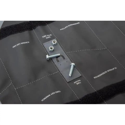 Close-up of UTV Tool Roll Kit with belt removal tools for Kawasaki Teryx KRX 1000, showing labeled sections and screws on roll bag.