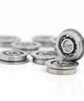 Top Shelf 10 Pack MF93 Flanged Bearings Featuring ABEC 3 Grade Precision, these tiny 3x9x2.5mm chrome steel ball units stacked.