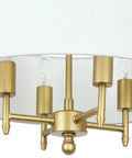 Close-up of 4 Light Modern Chandelier With White Linen Drum Shade In Antique Brass Finish For Dining Room.
