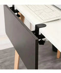 Heavy Duty Foldable Shelf Brackets For Desk Extension Clamps Punch Free Tabletop Mount Black Steel attached to a wooden desk.