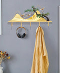 Sick Wall Mount Coat Rack with 5 Sturdy Hooks for Your Entryway Glow Up, heavy duty metal, golden design, hangs headphones and coat.
