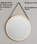 BSTiltion Magnetic Stud Finder for Wall Mounting Projects used on a wall with a mirror, showing its magnetic feature in action.