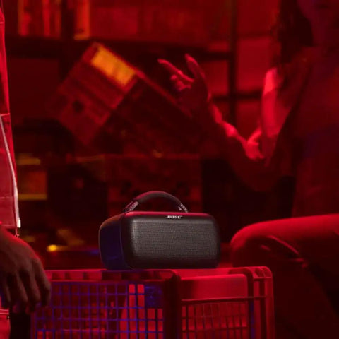 SoundLink Max Bluetooth Speaker Portable Party Ready With Deep Bass And Big Sound IP67 Waterproof Rope Handle resting on a crate