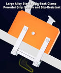 Large alloy steel eagle-beak clamp gripping a beam, secure slip-resistant industrial mounting bracket