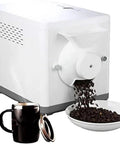 Kickin Electric Home Roaster For Coffee Beans And Tree Nuts 1600 Watt Automatic Stirrer With Precise Temp Controls Top Shelf 1500 Gram Batch Processor For Daily Grind with coffee spilling out.
