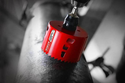 Diablo carbide teeth hole saw, red, close-up view, 2-3/4 in diameter for wood and metal.