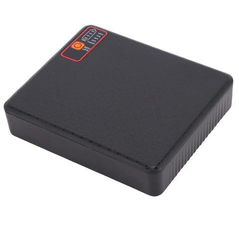 Mini UPS 15600mAh Battery Backup For Router And Modem USA Plug, compact black power supply unit with LED indicators.