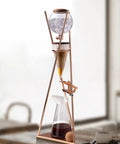 Premium Smooth Cold Brew Drip Tower With Sturdy Stainless Steel Stand Adjustable Flow Controller Iced Coffee Maker on wooden table.
