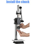 Hands installing chuck on Kickass Hella Tough Industrial Grade Manual Arbor Press With Accurate Scale Plate And Quick Change Chuck.