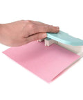 Hand using Word Punch Board For Scrapbooking And Card Making Dope Letter Punch Set With 26 Letters, aligning pink paper.