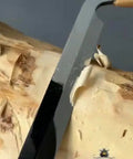 Pro Grade Dual Handle Draw Knife Sporting A Killer Razor Edge And Sweet Grip cutting through wood shavings on log
