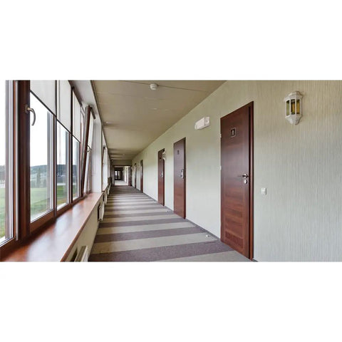 Built Legit Dual Head LED Emergency Light installed in commercial hallway with multiple doors and windows.