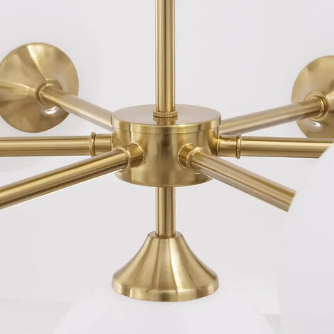 Gold Seven Light Glass Globe Sputnik Chandelier Pendant central metal hub detail, part of large hanging lamp fixture.