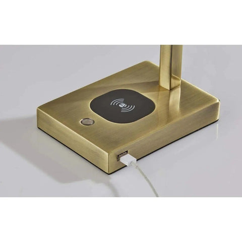 Base of Aidan LED Wireless Charging Desk Lamp With Built In 5W Qi Pad, showing brass finish and USB port on sleek design