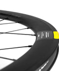 Close-up of Beefy 50mm Deep Carbon Wheelset tubeless rim and basalt braking surface with visible spokes.