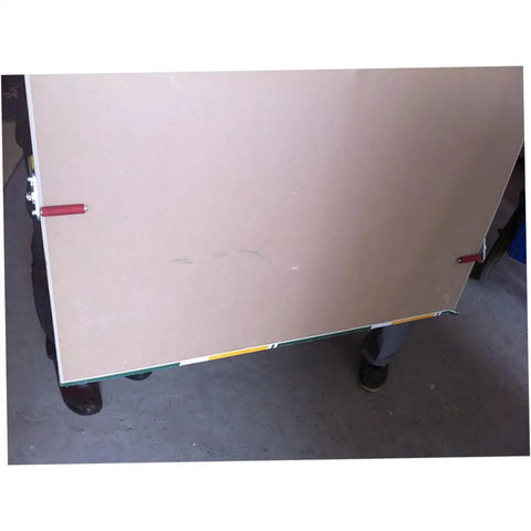 Heavy Duty Ceramic Tile Lifter And Gypsum Board Carrier Featuring Robust Antislip Clamps For Smooth Glass Transport And Effortless Drywall Movement Built Tough For Pros And Handymen Seeking Zero Sweat Today lifting a gypsum board with clamps.