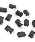 125V To 250V SPDT Snap Action Micro Limit Switch Button For Microwave Ovens And Arcade Door Interlocks, 1NO 1NC, 16A Rating, 12 Pack. Black plastic body, laying on a white surface.