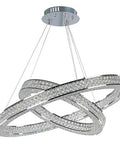 Hella Sharp Six Light Ceiling Pendant With Glossy Polished Chrome Trim And Classic Beveled Crystal Glass Shades above a dining table.