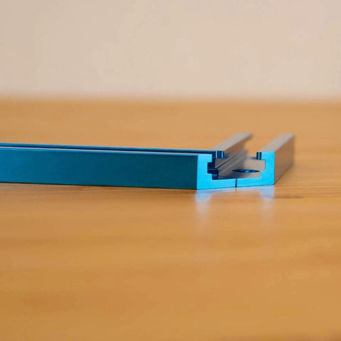 Intersections Kit for T Track Systems Dual T Track Intersections with predrilled mounting holes on wood surface close-up