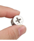 Hand holding Three In One Thickening Connector Eccentric Wheel For Furniture Hardware, 15mm diameter, zinc alloy, nickel plated