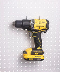 Six Pack Heavy Duty Pegboard Drill Holder Set With Rubber Coated Tool Hooks For Drills And Power Tools Keeps Garage Or Shed Neat And Within Easy Reach holding a power drill on pegboard