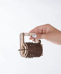 DIY 3D Wooden Cryptex Puzzle Kit With Real Working 3 Digit Combination Lock For Adults Hands On Build Your Own Secret Code From 1000 Possible Arrangements Da Vinci Code Inspired 34 Piece Model Kit held by hand