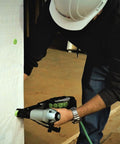 Person using Cap Stapler For Roofing Felt Foam Insulation And House Wrap On The Job Ready Lightweight Pneumatic Nailer 18 Gauge