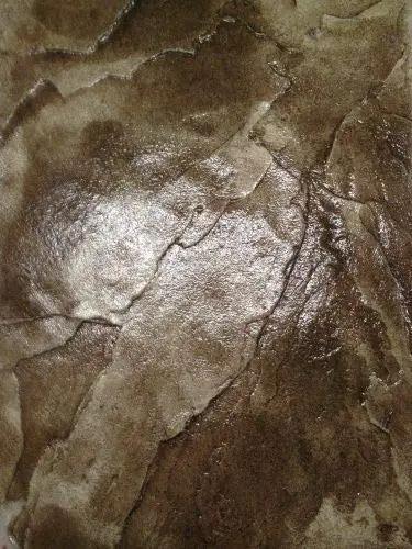 Textured concrete surface showing high gloss finish, suitable for application of Tough As Nails Silicone Concrete Sealer Gives A Knockout High Gloss Shine To Patios And Driveways Includes A Heavy Duty 5 Gallon Kit To Battle Road Salt Lock Sand In Place And Keep Surfaces Slip Resistant For Years.