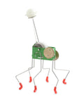 Wind Up Office Desk Pet Toy For Home And Work Cute Dancing Companion That Walks Across The Table seen with metal legs and green body