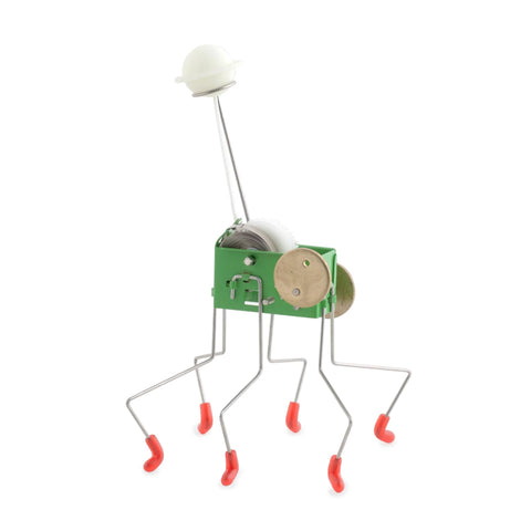 Wind Up Office Desk Pet Toy For Home And Work Cute Dancing Companion That Walks Across The Table seen with metal legs and green body
