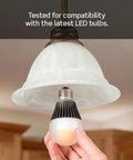 Hand installing LED bulb compatible with Decora Slide Dimmer Switch For Dimmable LED Halogen And Incandescent Bulbs DSL06-1LZ.