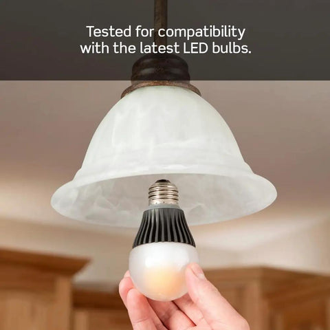 Hand installing LED bulb compatible with Decora Slide Dimmer Switch For Dimmable LED Halogen And Incandescent Bulbs DSL06-1LZ.
