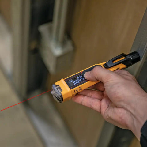 Non Contact Voltage Tester Pen 12 To 1000V AC With Built In Laser Distance Measure LED Alerts And Audible Alarms Pocket Clip For Quick Safe Electrical Checks On Cables Breakers And Outlets in hand