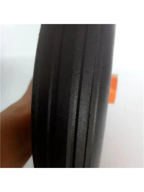 Built Tough 14 Inch Hella Durable Solid Rubber Caster Wheel For Heavy Duty Industrial Trolley and Mining Cart Replacement Knockout close-up of rubber wheel's side texture.