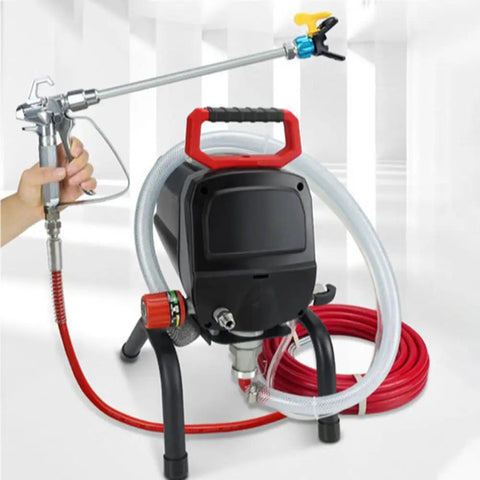 Heavy Duty 950W Airless Electric Paint Sprayer With Adjustable Stand And 10M High Pressure Hose in action with accessory nozzle.