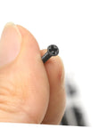 Top Tier Mini Screw Assortment Kit With 18 Assorted Sizes High Hardness Carbon Steel Black Fasteners held in hand.