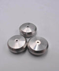Top view of three silver metal seat seals with central holes for waterjet cutting machines